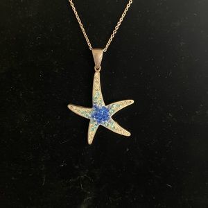 Sterling silver CZ accent starfish pendant.